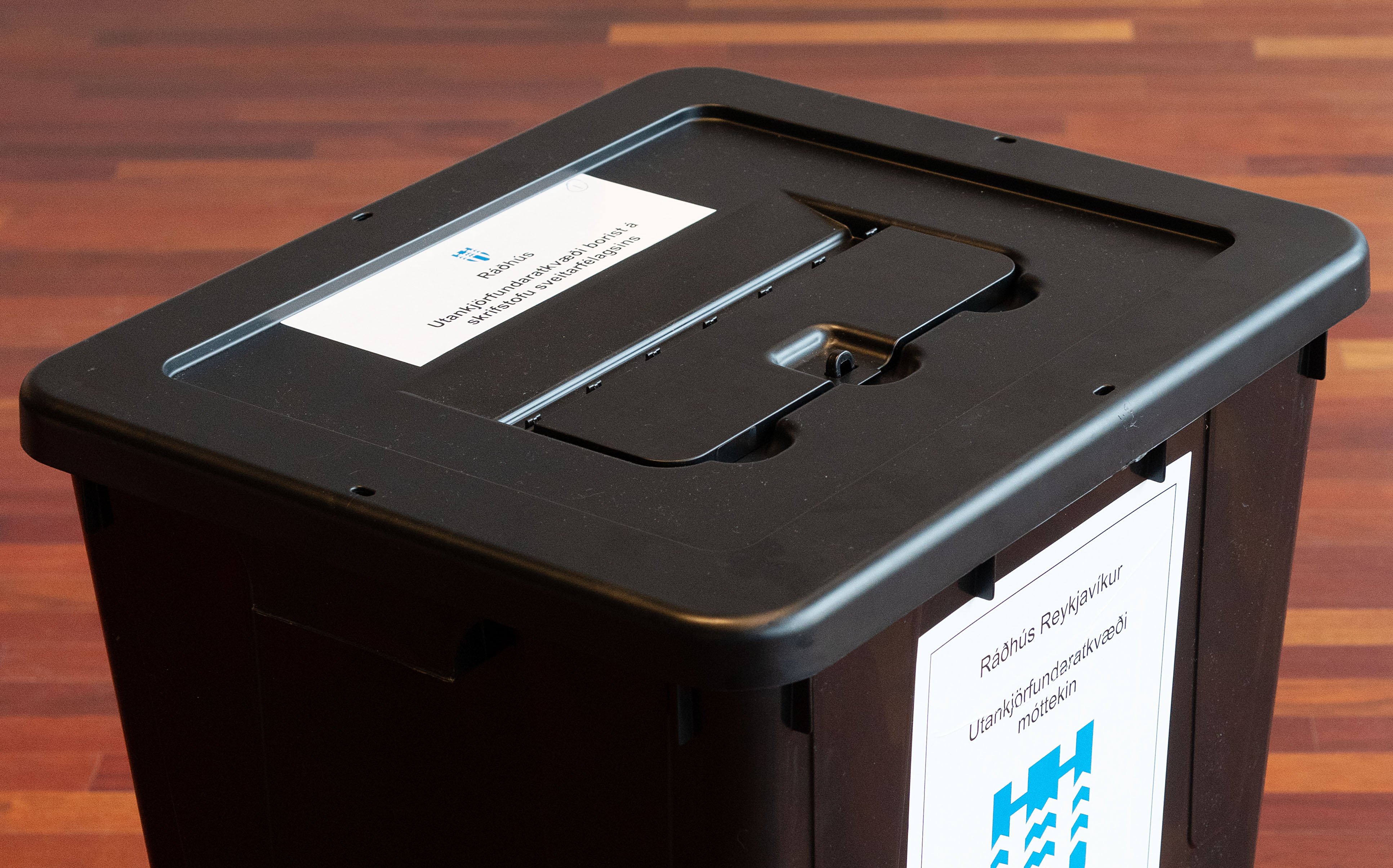 Ballot box. Black ballot box with labels reading "City Hall — early ballots received at the municipal office."