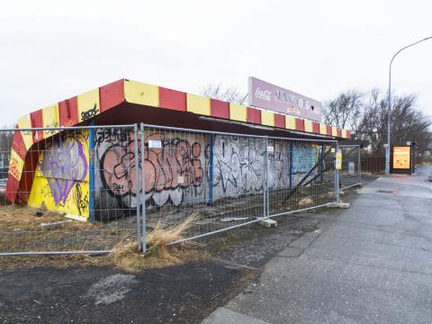 Sunnutorg, fence in front, graffiti on the building itself