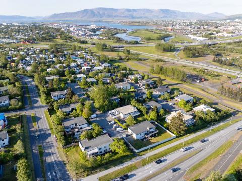 Overview of the city. Sogavegur on the left, Bústaðarvegur on the right. Aerial photo, summer.