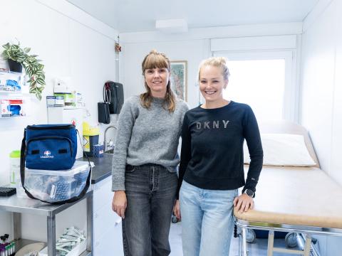 Sigríður Ella and Svala Dís stand together inside the Ylja supervised consumption site where they work. 