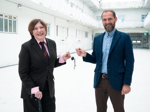 Ólöf Kristín Sigurðardóttir hands over the keys to Reykjavík Art Museum to Markús Þór Andrésson during their formal transition ceremony.