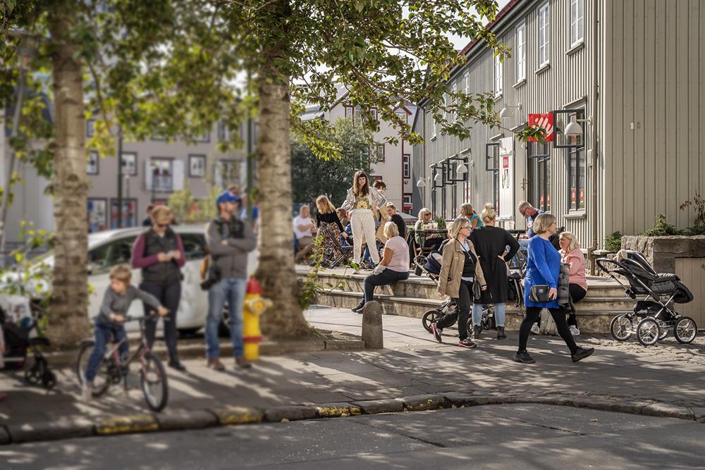 People in the city center on a sunny day.