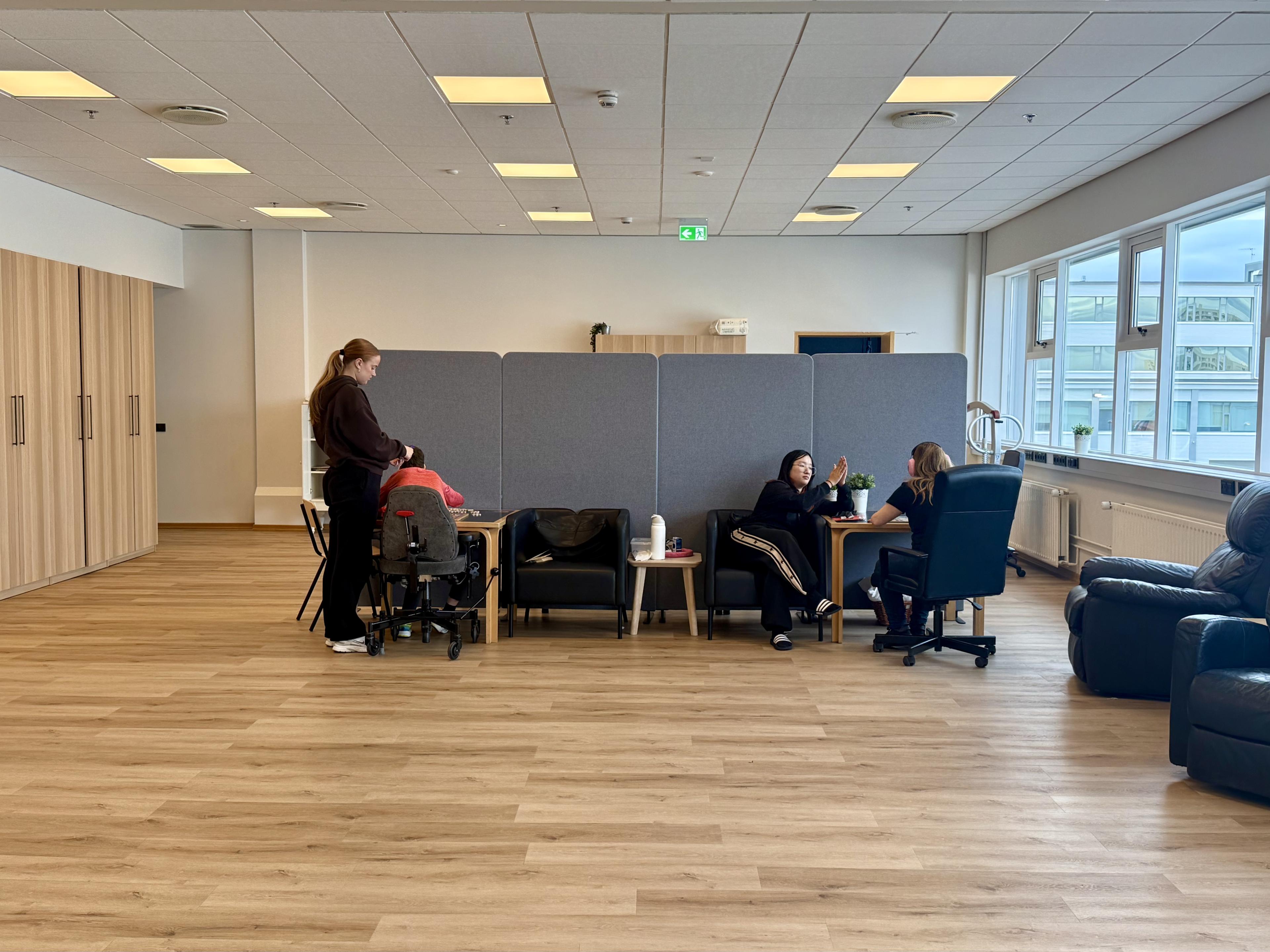 Two staff members and two service users together at Skeifan 8. 