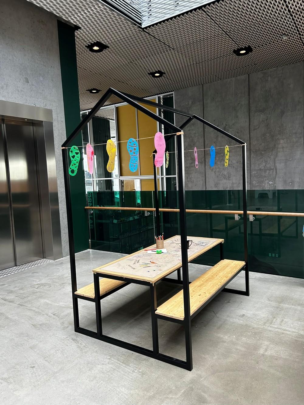 Shoes hanging at an art exhibit.