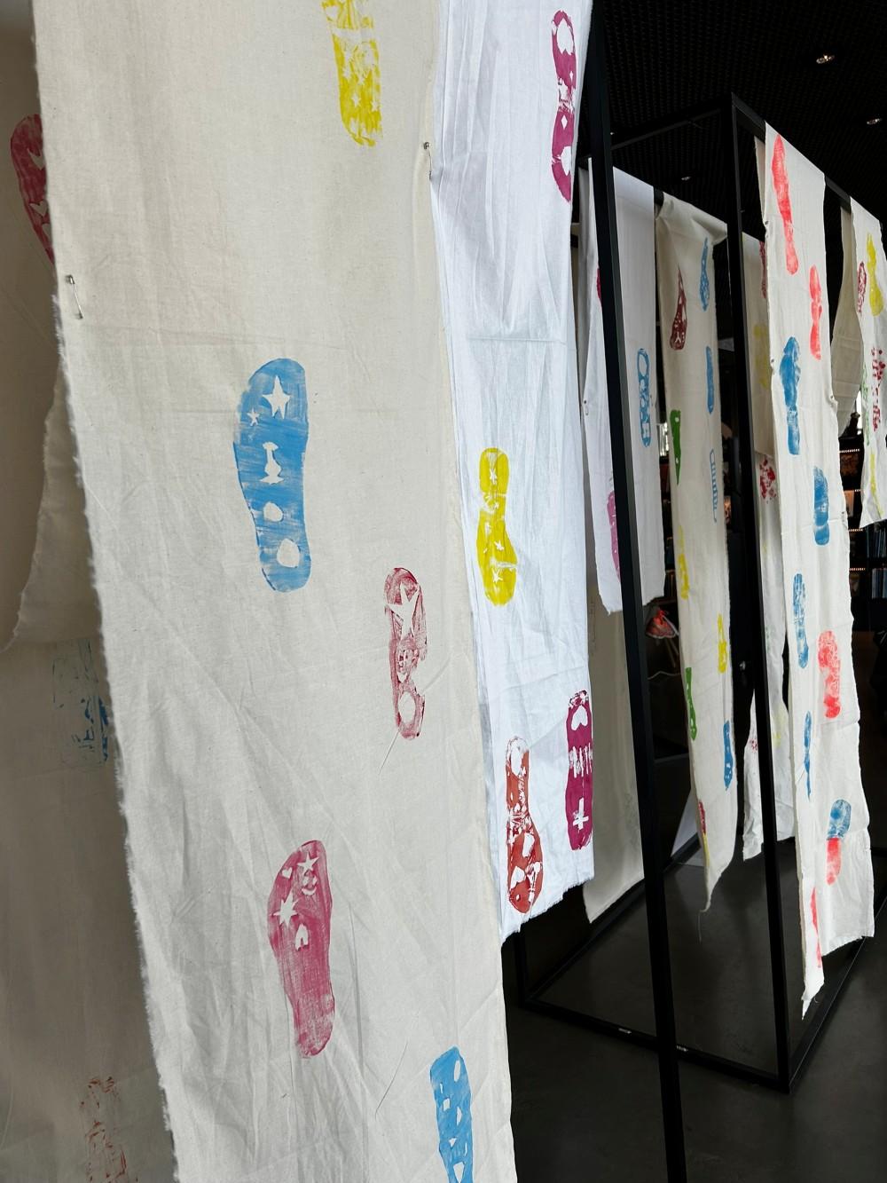 Footprints on a fabric strip.