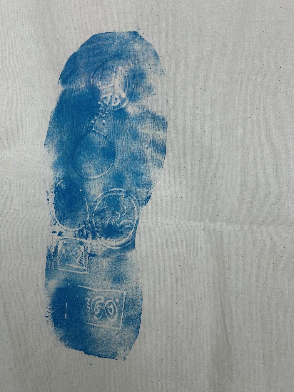 Footprints on a fabric strip.