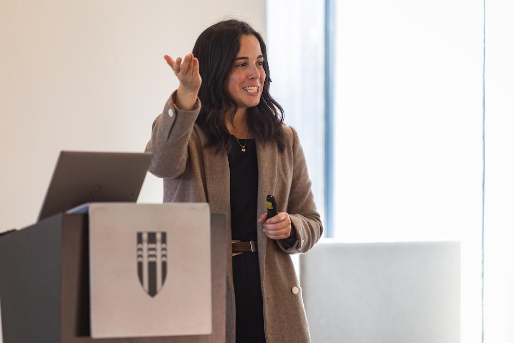 Woman speaking on stage.