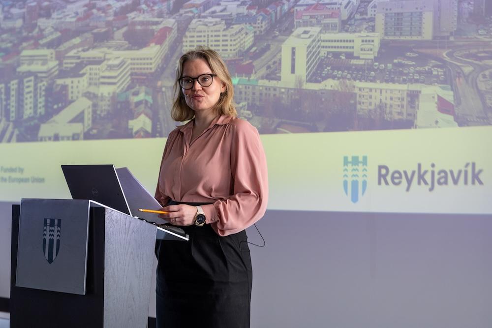 Woman speaking on stage
