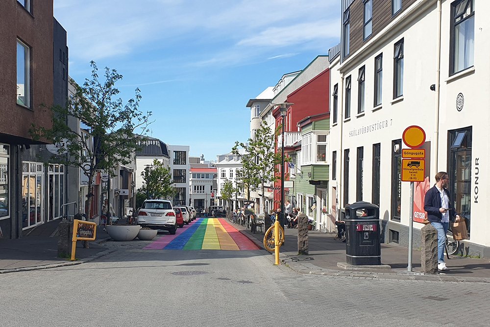 Looking down Skólavörðustígur street with rainbow colors.