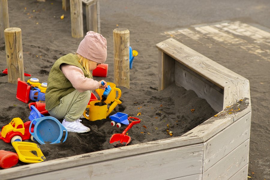 Girl playing in the sandbox at Borg preschool
