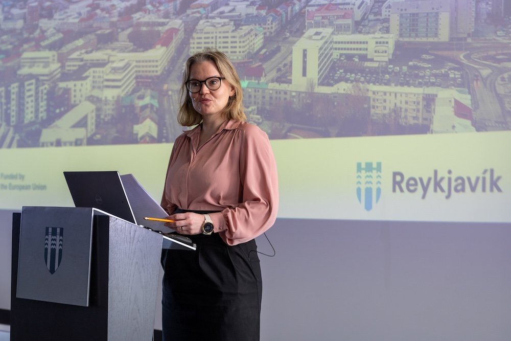 Woman speaking on stage