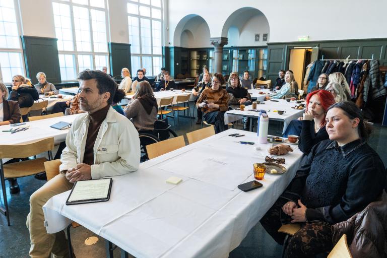 Conference at the House of Collections on LGBT+ safety. People sitting in the hall.