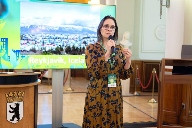 woman speaking into a microphone