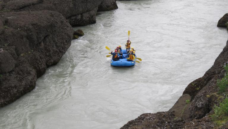 Kids sailing on a boat. 