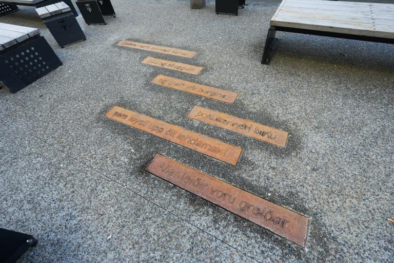Sigurður Pálsson's poem embedded in the pavement beside Tollhúsið.
