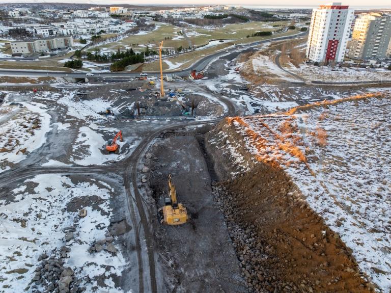 Heavy machinery performs earthwork for the project.