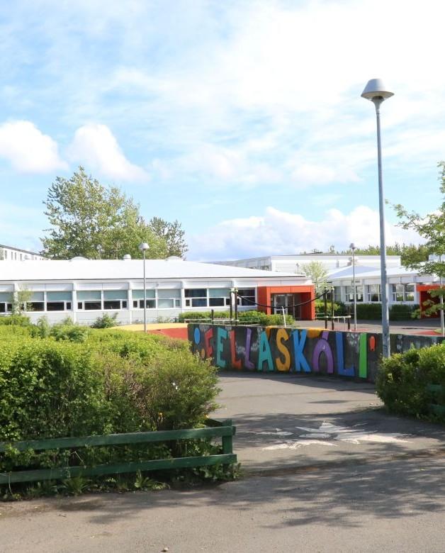 Fellaskóli, photographed in summer with lush vegetation in view