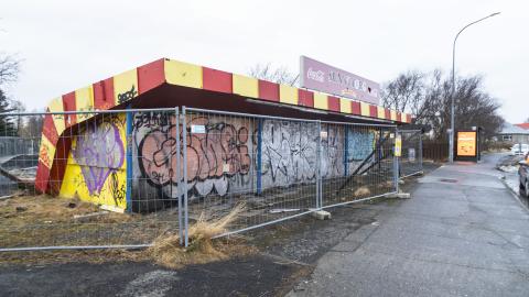 Sunnutorg, fence in front, graffiti on the building itself