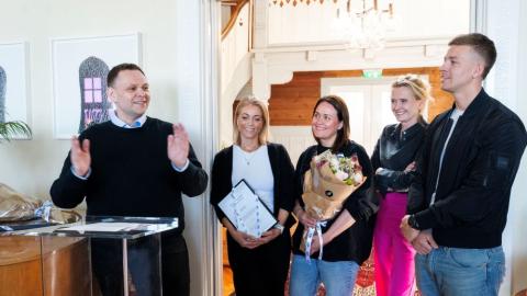 Five people celebrate award at Höfði