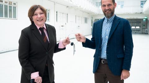 Ólöf Kristín Sigurðardóttir hands over the keys to Reykjavík Art Museum to Markús Þór Andrésson during their formal transition ceremony.