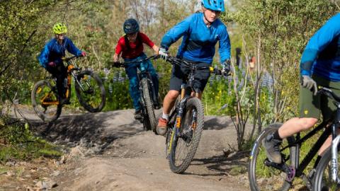 Young people on bicycles near Gufunesbær
